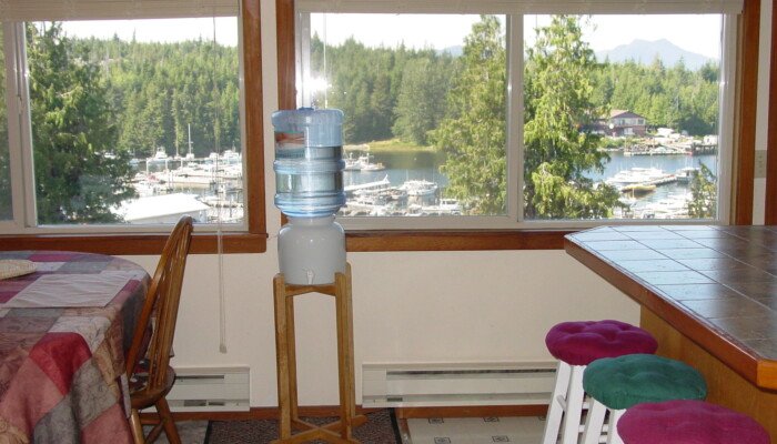 Room with lake view, water dispenser, colorful stools