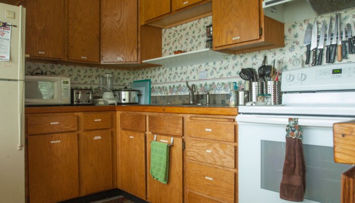 Cozy vintage kitchen with wooden cabinets and appliances