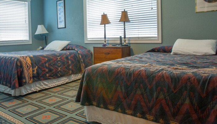 Cozy twin-bedded room with Southwestern style decor