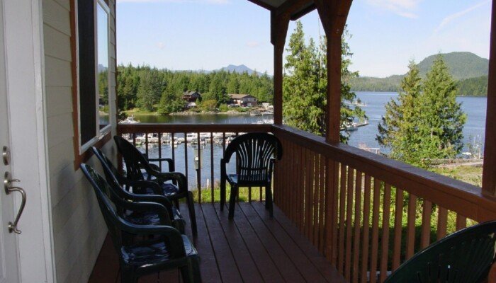 Serene lake view from shaded cabin porch